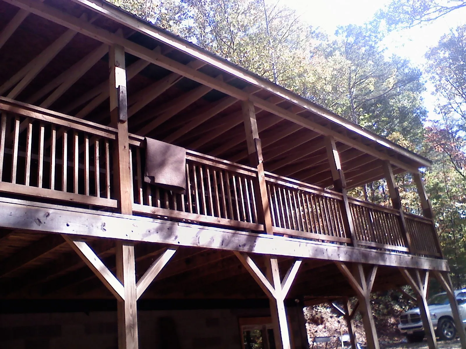 Timber framing under a new elevated porch and deck — Roof Leak Repair in South Portland by Roofing Brothers